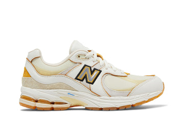 New Balance 2002R Joe Freshgoods Conversations Amongst Us, crème, liserés jaune orangé